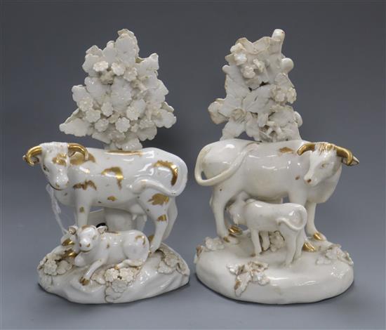 A pair of Derby white and gilt cow and calf groups, c.1810-30, 14.5cm, cf. DG Rice English Porcelain Animals, fig.122